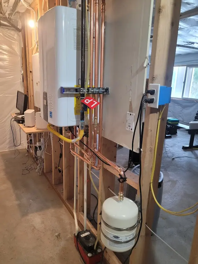 Licensed plumber repairing a kitchen sink in Williamson